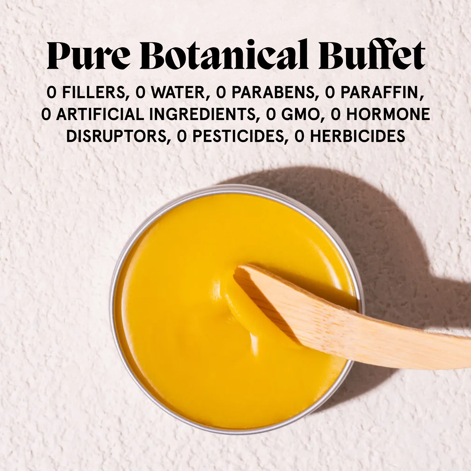 Open Acne Killer balm with bamboo spatula beside a free-from Pure Botanical Buffet graphic